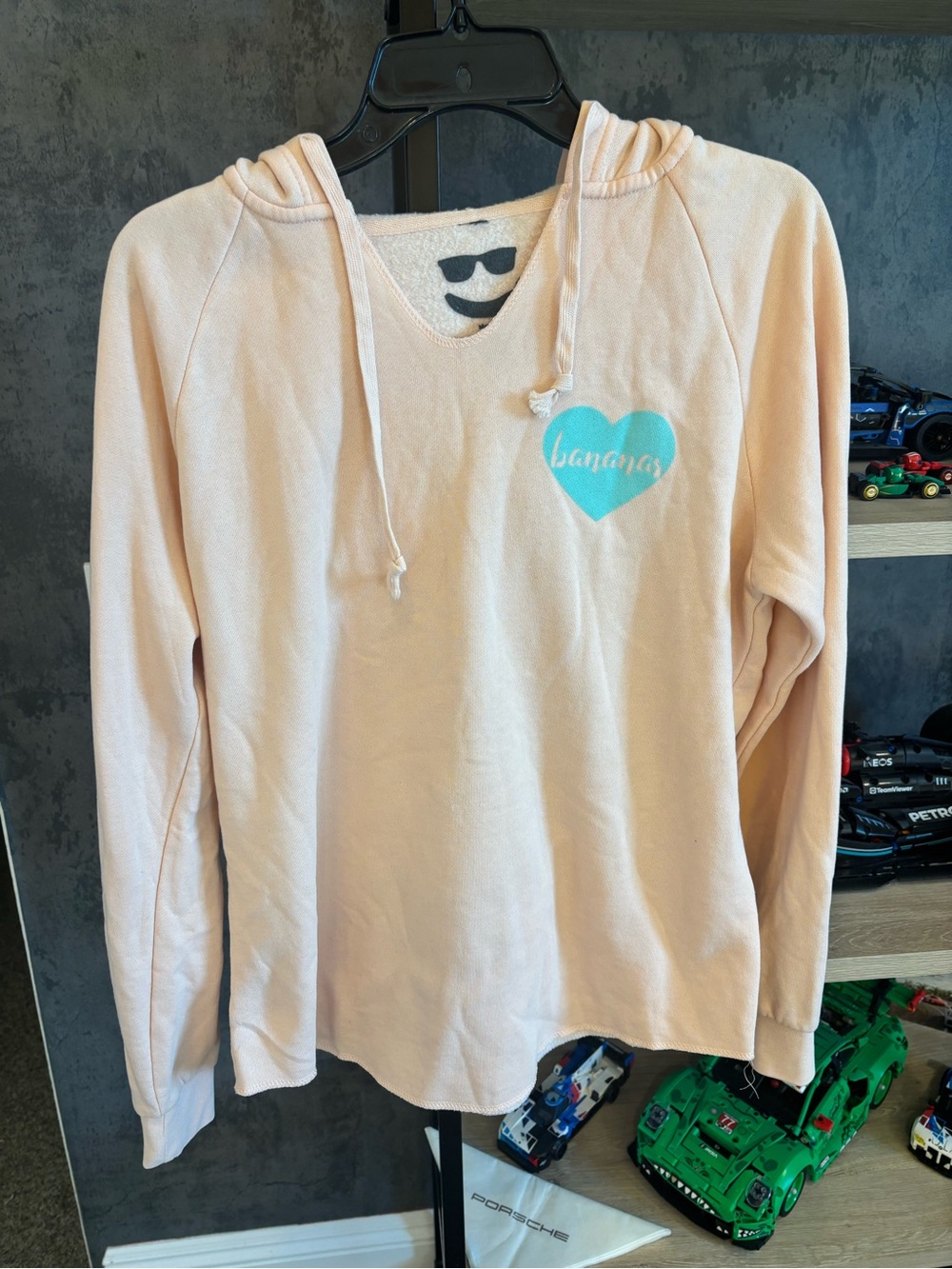 JOHNNY BANANAS Light Peach Hoodie with Teal Heart Graphic
